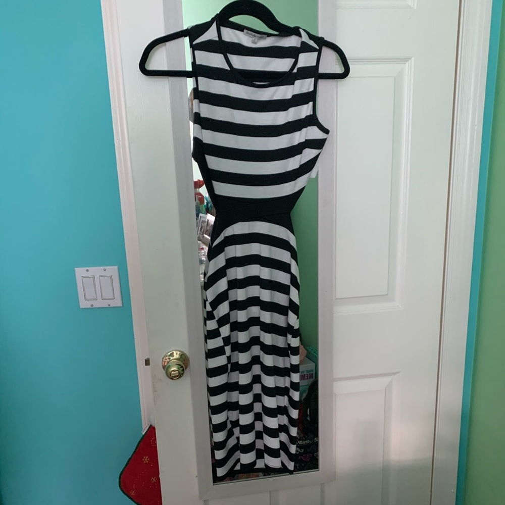 Brand new dress , cut open back size medium